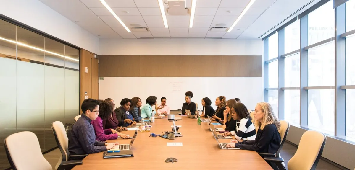 People having a meeting at a large table